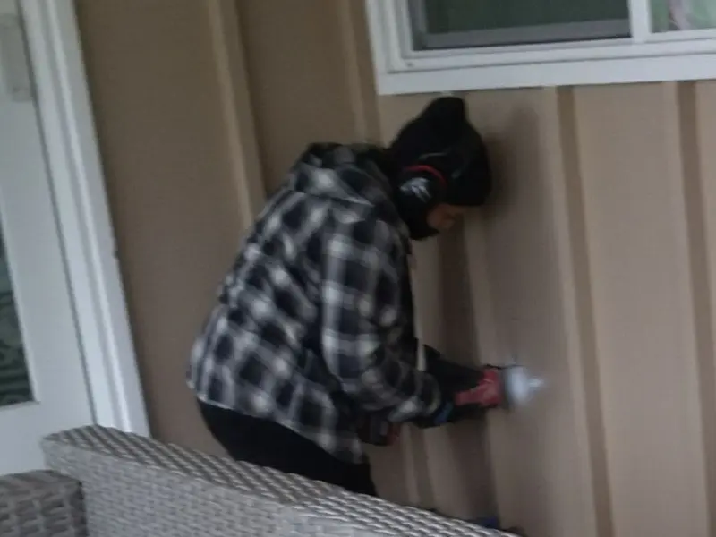 Professional electrician installing an exterior outlet in Haddonfield